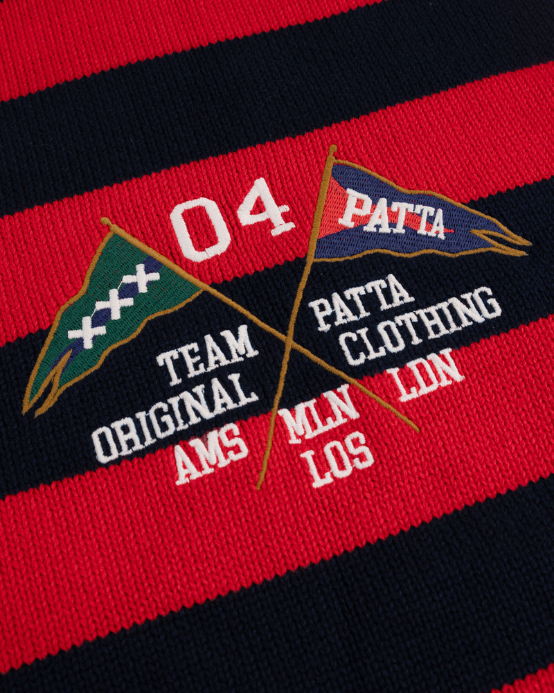Close up shot of the embroidery of the striped flag knit